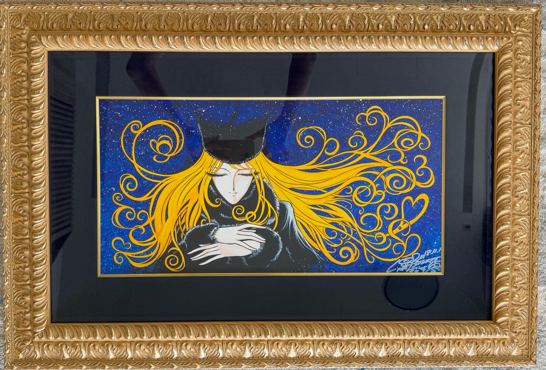 Gold framed anime artwork